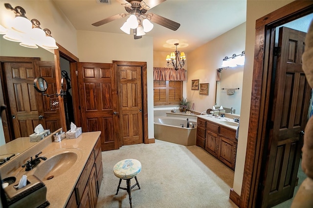 1702 High Point Dr, Pilot Point, TX 76258 - full bath with a garden tub, two vanities, ceiling fan, and a chandelier