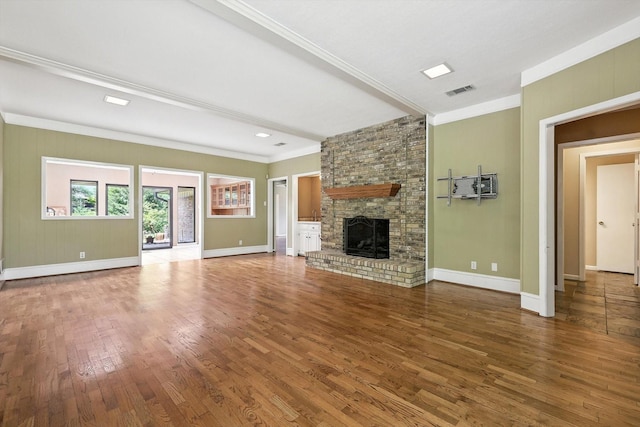 9901 Burnham Dr, Dallas, TX 75243 - unfurnished living room with crown molding, wood finished floors, and a fireplace