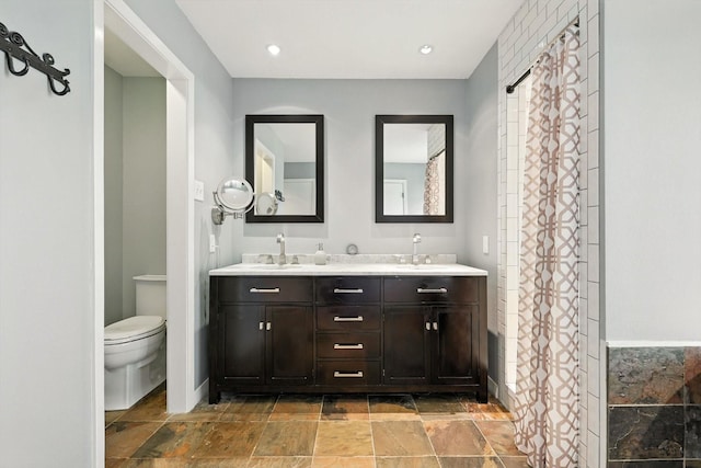 9901 Burnham Dr, Dallas, TX 75243 - bathroom with stone tile flooring and double vanity