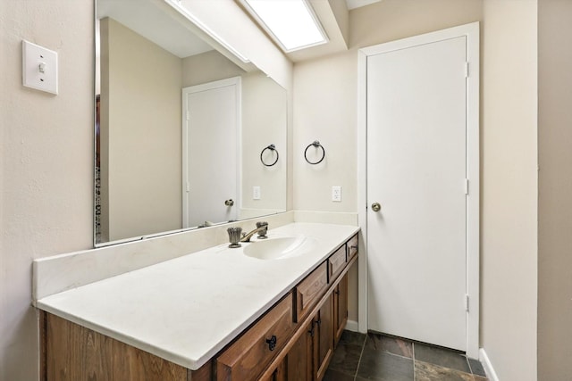 9901 Burnham Dr, Dallas, TX 75243 - bathroom with vanity and stone finish floors