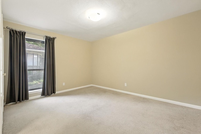 9901 Burnham Dr, Dallas, TX 75243 - unfurnished room with carpet floors and baseboards