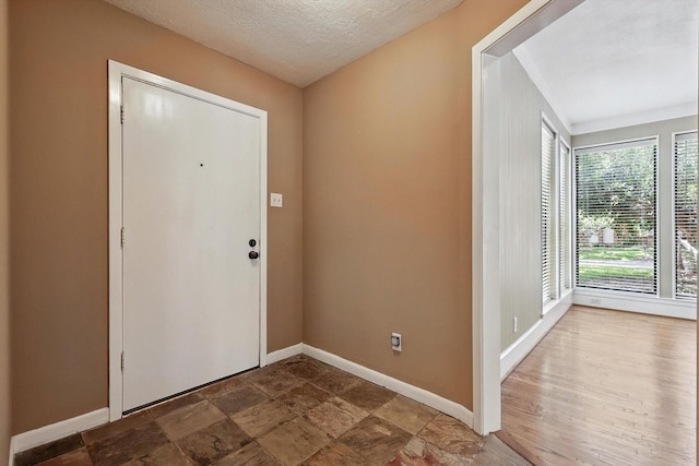 9901 Burnham Dr, Dallas, TX 75243 - entryway featuring baseboards