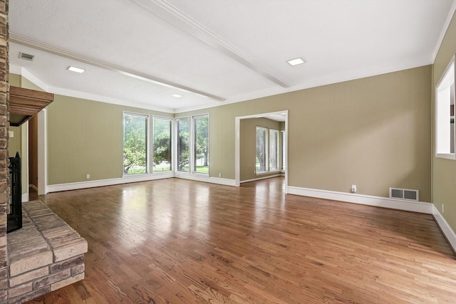 9901 Burnham Dr, Dallas, TX 75243 - unfurnished living room featuring wood finished floors, beamed ceiling, and ornamental molding