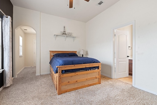 1916 Sterling Trace Dr, Keller, TX 76248 - bedroom with carpet flooring, arched walkways, ensuite bath, and ceiling fan