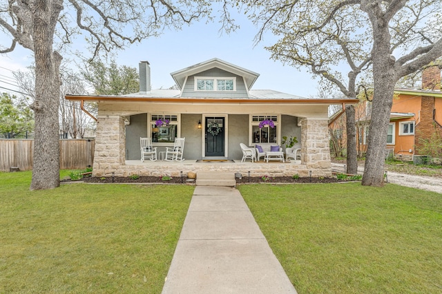 887 N Clinton St, Stephenville, TX 76401 - bungalow-style house with a porch, stucco siding, a chimney, and stone siding