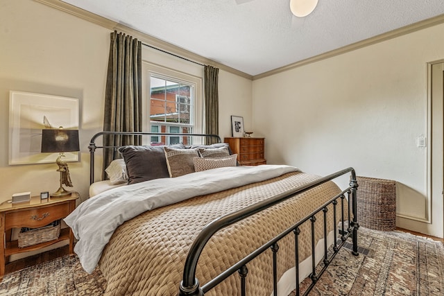 887 N Clinton St, Stephenville, TX 76401 - bedroom featuring ornamental molding and a textured ceiling