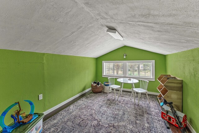 887 N Clinton St, Stephenville, TX 76401 - rec room featuring lofted ceiling and a textured ceiling