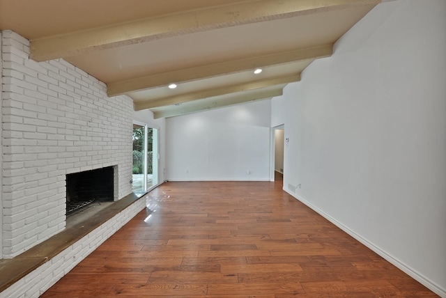 4949 Mill Run Rd, Dallas, TX 75244 - unfurnished living room featuring beamed ceiling, a fireplace, wood finished floors, and recessed lighting
