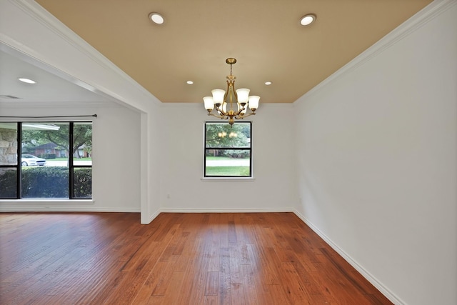 4949 Mill Run Rd, Dallas, TX 75244 - spare room featuring healthy amount of natural light, a chandelier, hardwood / wood-style floors, ornamental molding, and recessed lighting