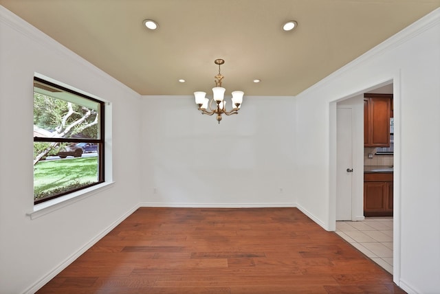4949 Mill Run Rd, Dallas, TX 75244 - unfurnished room with a chandelier, light wood-type flooring, ornamental molding, and recessed lighting