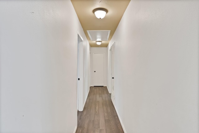 4949 Mill Run Rd, Dallas, TX 75244 - hallway featuring attic access and wood finished floors
