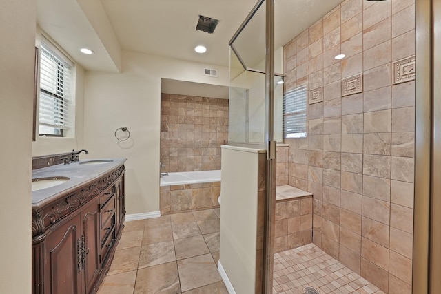 4949 Mill Run Rd, Dallas, TX 75244 - bathroom featuring a bath, double vanity, tile patterned floors, a stall shower, and recessed lighting