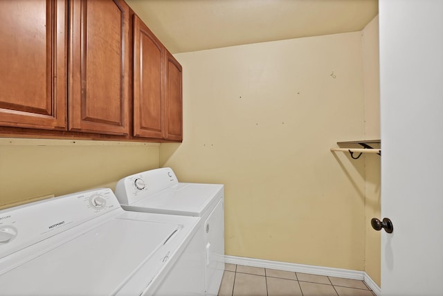 4949 Mill Run Rd, Dallas, TX 75244 - laundry area with washer and dryer, light tile patterned floors, and cabinet space