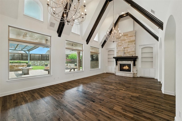 4510 Woodbine Ln, Prosper, TX 75078 - unfurnished living room with a chandelier, high vaulted ceiling, a fireplace, built in features, and healthy amount of natural light