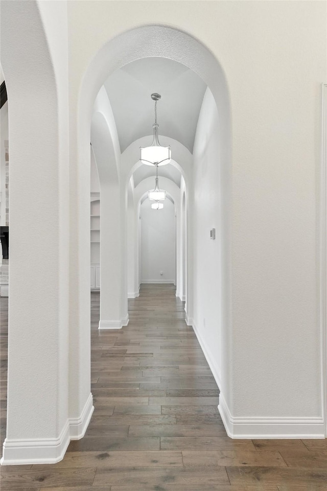 4510 Woodbine Ln, Prosper, TX 75078 - corridor featuring arched walkways and wood finished floors