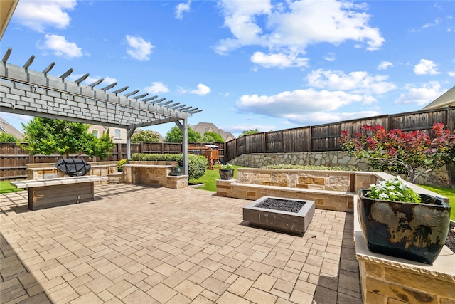 4510 Woodbine Ln, Prosper, TX 75078 - fenced backyard featuring a fire pit, a patio, and a playground