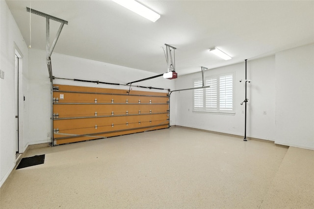 4510 Woodbine Ln, Prosper, TX 75078 - garage featuring a garage door opener and baseboards