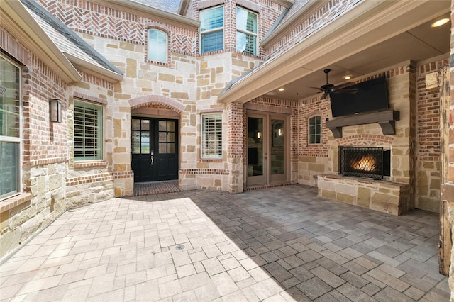 4510 Woodbine Ln, Prosper, TX 75078 - view of patio / terrace featuring an outdoor stone fireplace and a ceiling fan