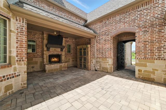 4510 Woodbine Ln, Prosper, TX 75078 - view of patio / terrace with a warm lit fireplace and ceiling fan