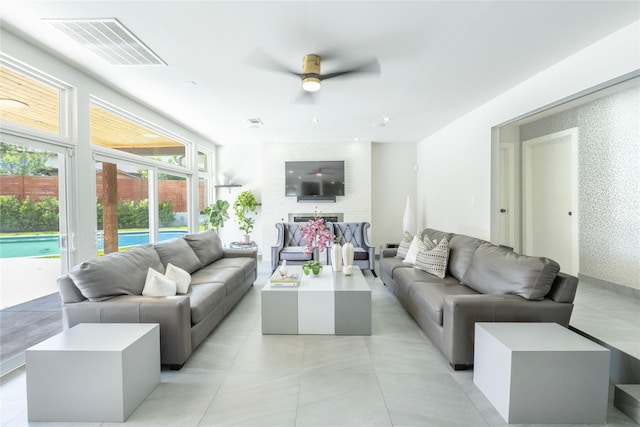 6956 Meadowbriar Ln, Dallas, TX 75230 - living area featuring a ceiling fan and a fireplace