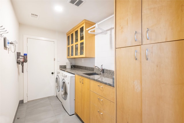 6956 Meadowbriar Ln, Dallas, TX 75230 - washroom with cabinet space, washer and dryer, and bar area