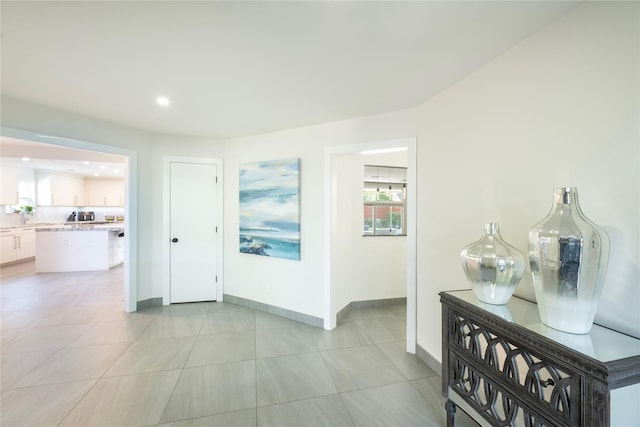 6956 Meadowbriar Ln, Dallas, TX 75230 - corridor featuring light tile patterned floors and recessed lighting