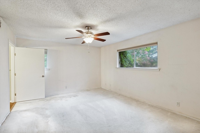 93 Regents Park, Bedford, TX 76022 - carpeted spare room featuring ceiling fan and a textured ceiling