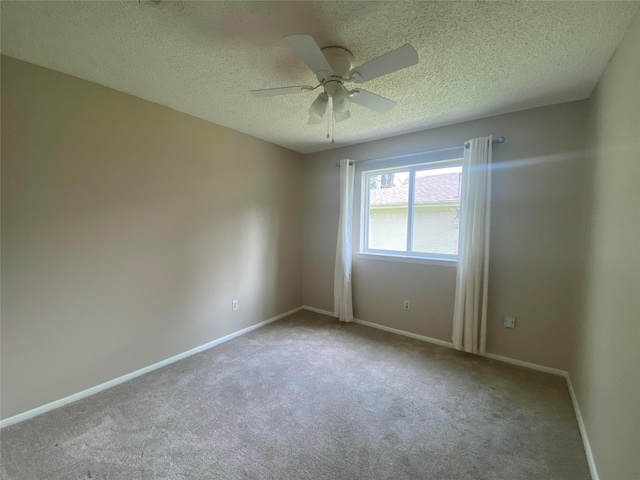 2225 Shady Brook Dr, Bedford, TX 76021 - empty room featuring carpet flooring, a textured ceiling, and ceiling fan