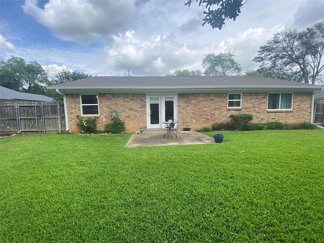 2225 Shady Brook Dr, Bedford, TX 76021 - back of property featuring a patio, brick siding, and roof with shingles