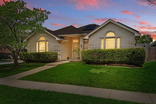 7436 Bennington Dr, Watauga, TX 76148 - view of front of home featuring solar panels and brick siding