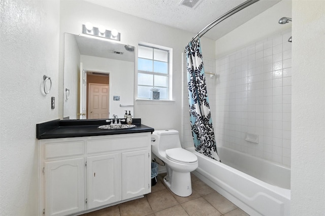 7436 Bennington Dr, Watauga, TX 76148 - bathroom with tile patterned floors, vanity, shower / bath combo with shower curtain, a textured ceiling, and a textured wall