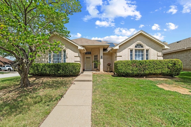 7436 Bennington Dr, Watauga, TX 76148 - view of front of property featuring brick siding and a front lawn