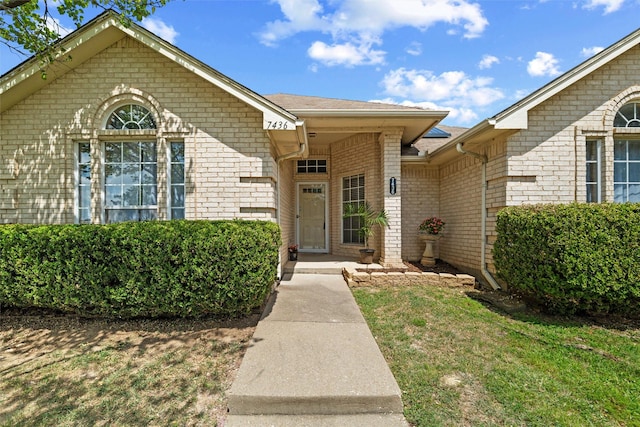 7436 Bennington Dr, Watauga, TX 76148 - doorway to property featuring brick siding
