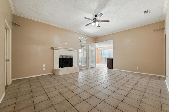 7436 Bennington Dr, Watauga, TX 76148 - unfurnished living room featuring ceiling fan, crown molding, a textured ceiling, a fireplace, and light tile patterned floors