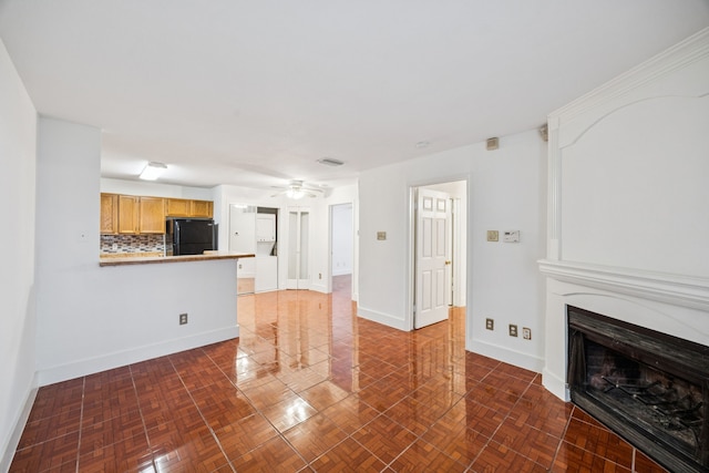 6108 Abrams Rd Unit 410, Dallas, TX 75231 - unfurnished living room featuring a large fireplace and ceiling fan