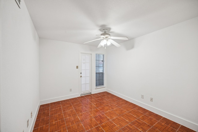 6108 Abrams Rd Unit 410, Dallas, TX 75231 - spare room with a ceiling fan and baseboards
