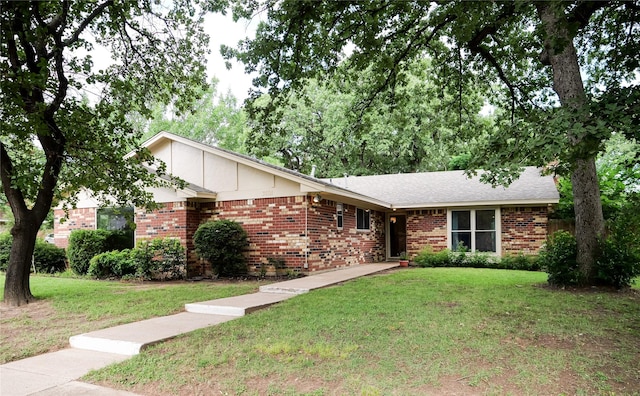 3501 Pecan Cir, Bedford, TX 76021 - ranch-style home with brick siding and a front lawn