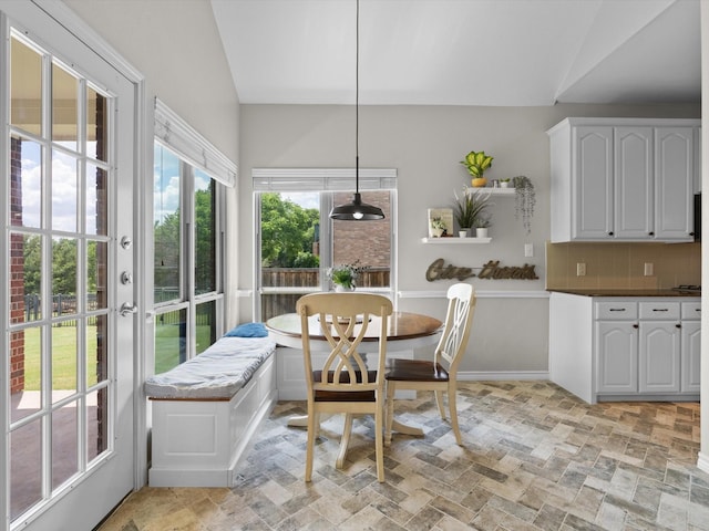 5503 Midnight Moon Dr, Frisco, TX 75036 - dining space featuring lofted ceiling and light stone finish flooring