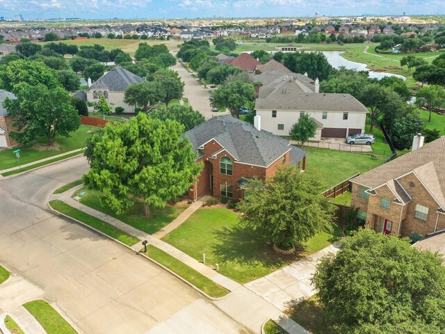 5503 Midnight Moon Dr, Frisco, TX 75036 - aerial perspective of suburban area with a nearby body of water