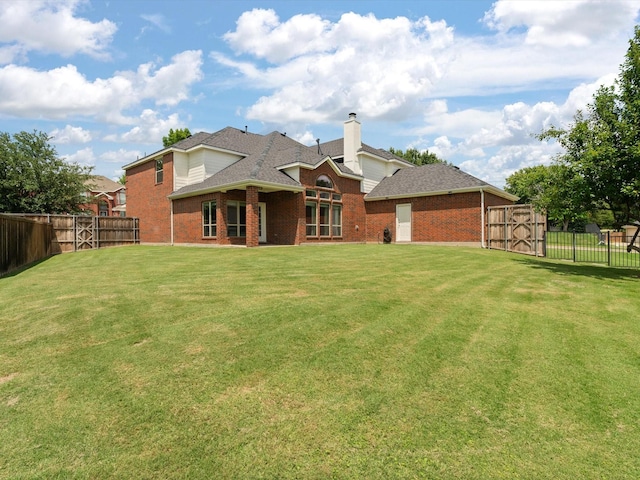 5503 Midnight Moon Dr, Frisco, TX 75036 - rear view of house featuring brick siding, a fenced backyard, a chimney, and roof with shingles