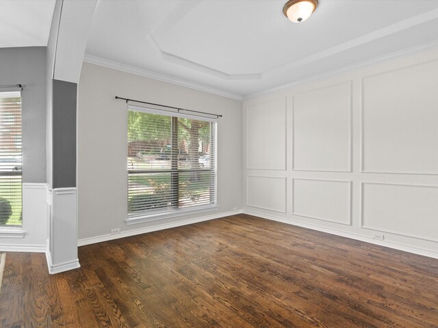 5503 Midnight Moon Dr, Frisco, TX 75036 - empty room with dark wood finished floors, ornamental molding, and a decorative wall