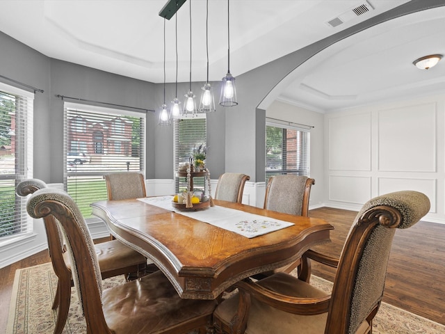 5503 Midnight Moon Dr, Frisco, TX 75036 - dining area with wood finished floors, arched walkways, and a tray ceiling