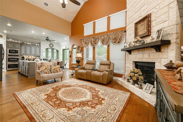 2604 Gavin Dr, Mansfield, TX 76063 - living area featuring ceiling fan, healthy amount of natural light, a fireplace, high vaulted ceiling, and recessed lighting
