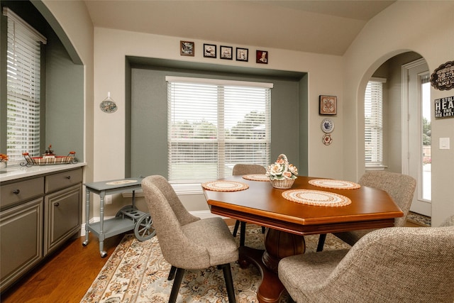 2604 Gavin Dr, Mansfield, TX 76063 - dining area with arched walkways, wood finished floors, and lofted ceiling