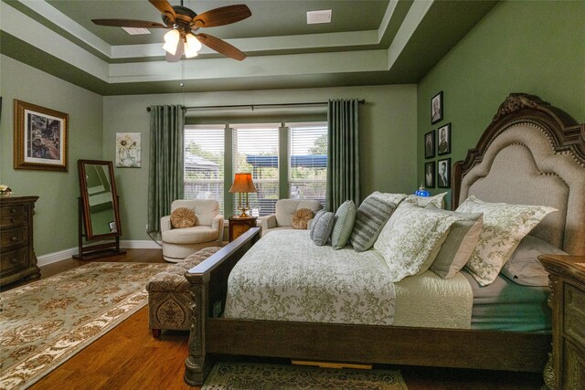 2604 Gavin Dr, Mansfield, TX 76063 - bedroom featuring a tray ceiling, wood finished floors, and ceiling fan