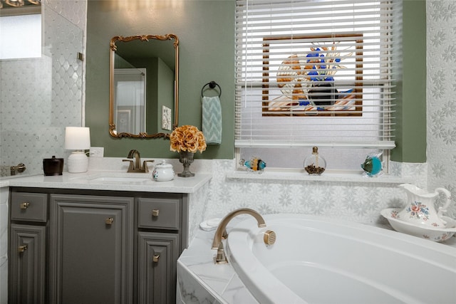 2604 Gavin Dr, Mansfield, TX 76063 - bathroom with vanity, a garden tub, wainscoting, and wallpapered walls