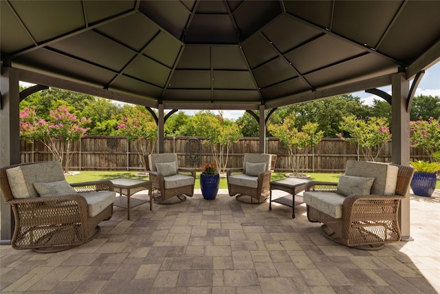 2604 Gavin Dr, Mansfield, TX 76063 - fenced backyard featuring an outdoor living space, a gazebo, and a patio