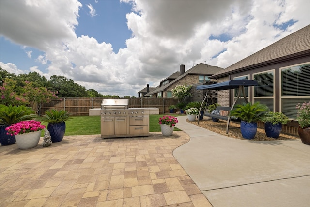 2604 Gavin Dr, Mansfield, TX 76063 - fenced backyard featuring a patio area and a grill
