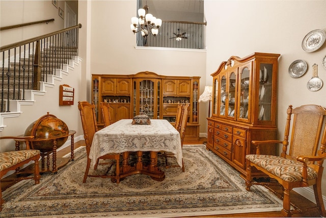 2604 Gavin Dr, Mansfield, TX 76063 - dining area featuring a high ceiling, stairs, a chandelier, and light wood finished floors