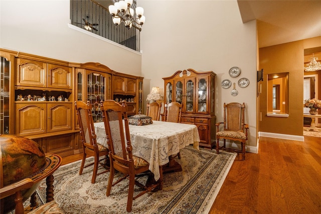 2604 Gavin Dr, Mansfield, TX 76063 - dining room with a chandelier, a high ceiling, and dark wood finished floors